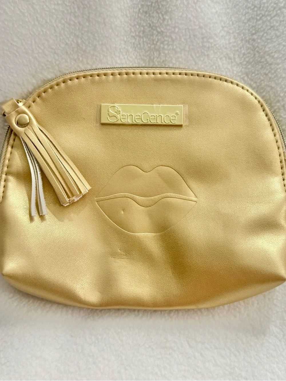 SeneGence Gold Cosmetic Pouch with Tassel and Lip Embossed, New Without Tags